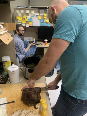 Ian cutting beef brisket